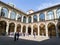 Courtyard of Biblioteca Comunale dell Archiginnasio library in Bologna, Italy with visiting tourists