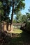 The courtyard of the dilapidated temple complex in Indochina. Ancient ruins in the forest