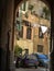 Courtyard with extended laundry seen by an arc to Palermo in Sicily, Italy.