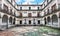 Courtyard of the Fountainheads (Patio de los Mascarones) at Royal Monastery of San Lorenzo de El Escorial near Madrid, Spain