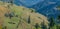 Courtyard on a green meadow over a valley of Carpathian Mountains, Ukraine