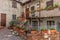 Courtyard, house and balcony with flowers.