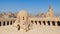 Courtyard of Ibn Tulun public historical mosque with ablution fountain and the minaret, Cairo, Egypt