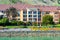 Courtyard Marriott hotel exterior view at scenic Oyster Point waterfront and green slopes of San Bruno Mountain ridge