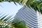 Courtyard by Marriott sign, in frame of palm leaves.