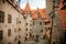 Courtyard of medieval majestic and romantic gothic castle Bouzov, old fairy-tale stronghold of Teutonic Order, fortress with stone