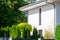 Courtyard of a modern country house with windows, drainpipes and shutters