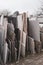 in the courtyard of a stonemason\\\'s workshop there are many different granite and marble slabs