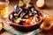 Couscous with mussels in earthenware bowl
