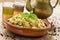 Couscous with vegetables and tea on a rustic wooden table