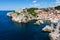 Cove and docks guarded by city walls and Fort Lovrijenac at Dubr