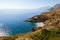 Cove with white beach and pristine blue sea in Sicily