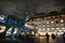 Covent Garden square by night decorated for Christmas with giant topiary reindeer.