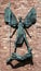 Coventry, UK - August 13 2019: A close-up of the sculpture on the exterior of Coventry Cathedral depicting St. Michaels victory