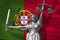 Cover about Law. Statue of god of justice Themis with Flag of Portugal background. Original Statue of Justice. Femida, with scale,