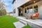 Covered back porch with concrete floor and stairs