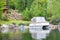 Covered boat next to the wooden house