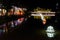 Covered bridge over a small river, night lighting, neon lights