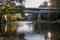 Covered bridge with sunstar and cliff