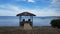 Covered hut on dock with chairs on water in Guanica, Puerto Rico