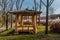 Covered picnic shelter next to field of feather grass