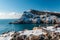 Covered with snow cliffs of Balaclava in winter. Winter landscape of the seaside town