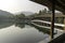 Covered walkway over calm lake