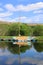 Covered yacht at berth on canal