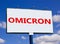 Covid-19 corona omicron variant symbol. The concept word Omicron on white billboard. Beautiful blue sky. Medical and COVID-19