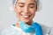 Covid-19, coronavirus disease, healthcare workers concept. Smiling relieved asian female doctor take-off respirator and