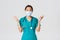 Covid-19, coronavirus disease, healthcare workers concept. Surprised and amazed asian female doctor in medical mask and