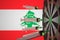 COVID-19 coronavirus disease vaccine syringes hit target against the Lebanese flag. Successful research and vaccination