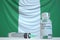COVID-19 coronavirus disease vaccine vial and syringe against the Nigerian flag. Medical research and vaccination in