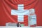 COVID-19 coronavirus disease vaccine vial and syringe against the Swiss flag. Medical research and vaccination in
