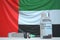 COVID-19 coronavirus disease vaccine vial and syringe against the UAE flag. Medical research and vaccination, 3D