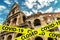 COVID-19 coronavirus in Italy, caution tape in photo of Colosseum in Rome. World tourist landmarks closed due to SARS-CoV-2 corona