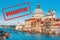COVID-19 coronavirus in Italy, stamp Quarantine in photo of Venice. Italian tourist attractions closed due to novel corona virus