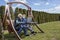 COVID 19 An elderly couple a man and a woman in medical masks in front of a laptop in a garden in a nursing home