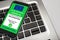 Covid-19 Green Pass. The digital green pass of the european union on the screen of a smartphone on the keyboard of a notebook,