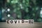 COVID-19 name of Corona virus text on wood block