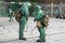 COVID-19 outbreak. Two medical workers in bio viral hazard protective suits spray of chemicals for disinfection from