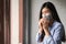 COVID-19 Pandemic Coronavirus, Asian woman have a cold and symptoms coughing, fever