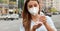 COVID-19 Pandemic Coronavirus Close up Woman with KN95 FFP2 Mask using Alcohol Gel Sanitizer Hands in City Street. Antiseptic,