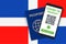 Covid-19 Passport on Dominican Republic Flag Background. Vaccinated. QR Code. Smartphone. Immune Health Cerificate. Vaccination