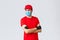 Covid-19, self-quarantine, online shopping and shipping concept. Confident courier in red uniform, protective gloves and