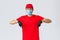 Covid-19, self-quarantine, online shopping and shipping concept. Startled and shocked courier in uniform, red cap and t