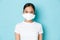 Covid-19, social distancing and coronavirus pandemic concept. Close-up of serious-looking asian girl in respirator and