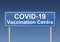 Covid-19 vaccination centre traffic sign, blue billboard, vector illustration in EPS 10