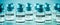 Covid-19 vaccine bottles on a blue background