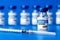 Covid-19 vaccine - coronavirus vaccination bottles. injection vials and syringe